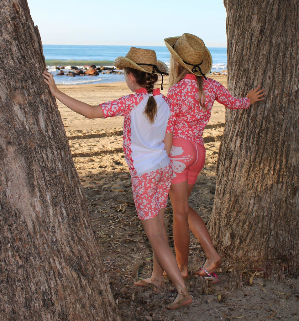 California Sunshine Kids Coral Swim shorts with large white floral print Age 4-11yrs - Jody and Lara