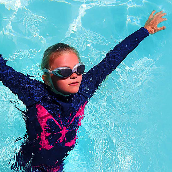 Beach Butterfly is the name given to this kids UPF 50+ swimwear collection. Girls modest swimwear in both long sleeve and short sleeve rash vests. This cover up childrens swimsuits are Mix and Match swim tops and shorts made from recycled plastic waste. 
