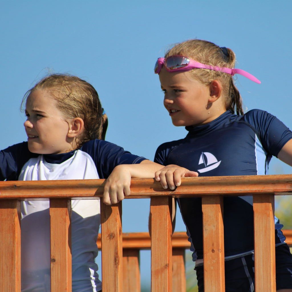 Sea Breeze White Sailboat Print on Kids Navy Short Sleeve Rash Vest