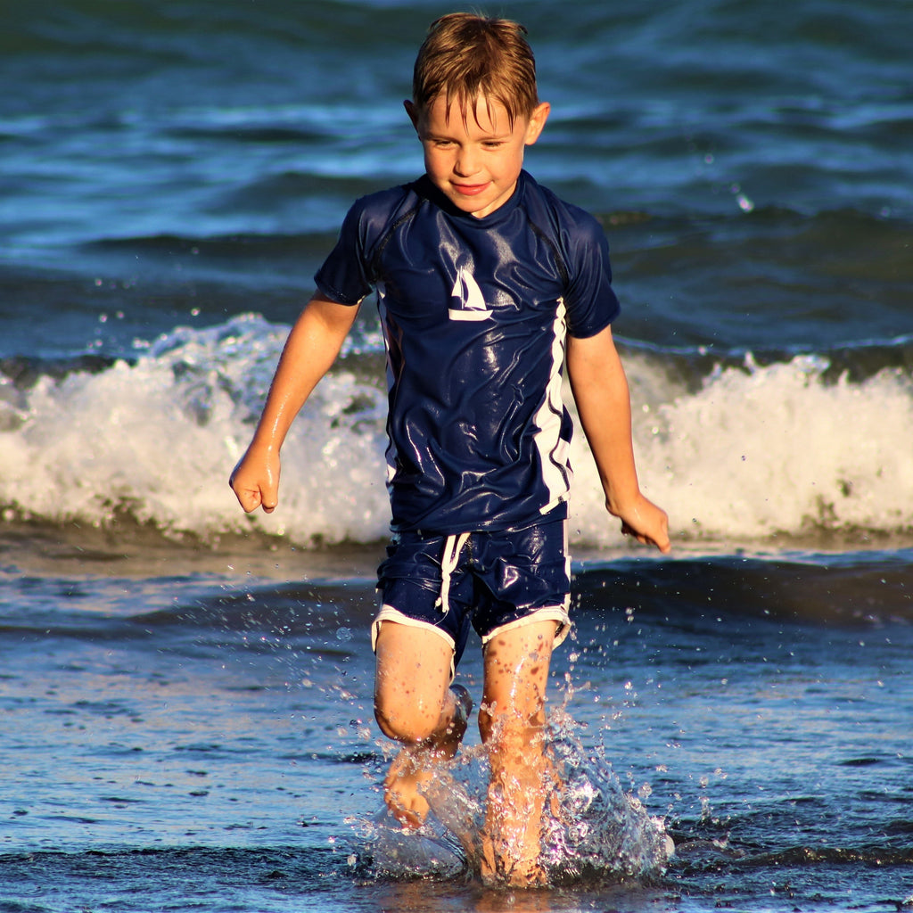 Sea Breeze White Sailboat Print on Kids Navy Short Sleeve Rash Vest