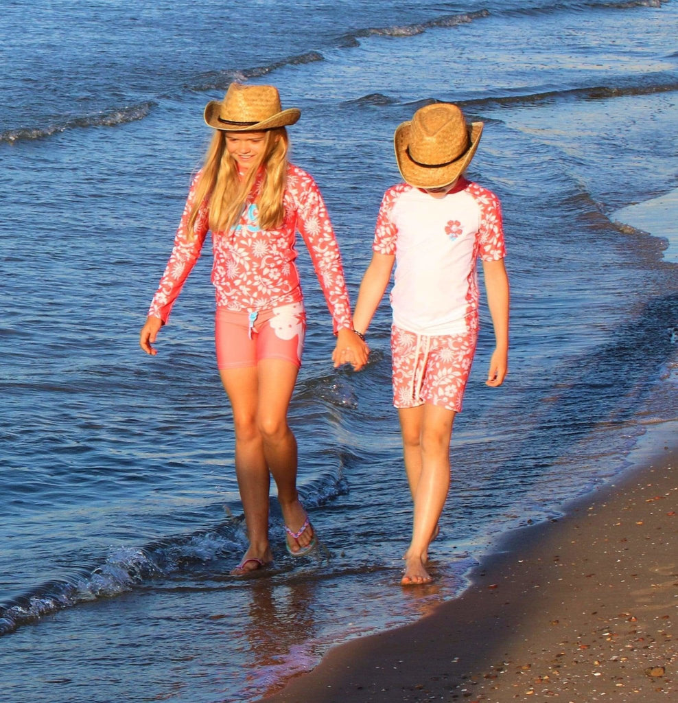 California Sunshine Kids Coral Swim shorts with large white floral print Age 4-11yrs - Jody and Lara